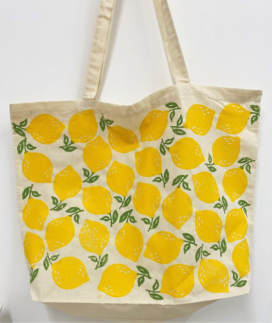 A hand block printed maxi tote bag in a leafy lemon design, hand printed with an Indian wooden printing block using a fabric paint