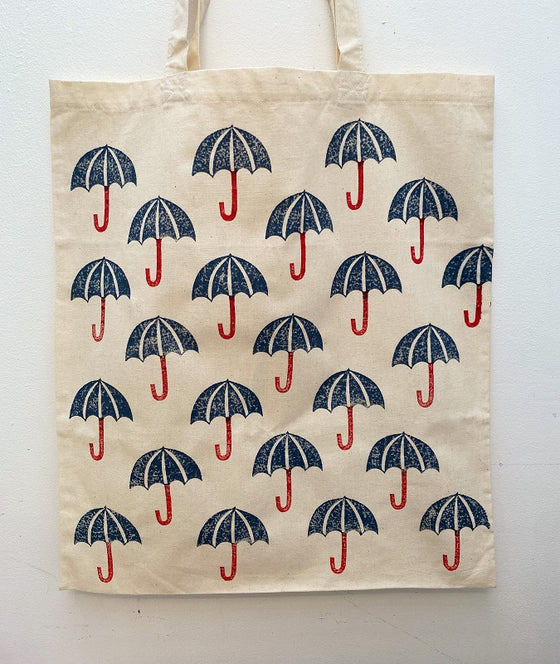 A hand block printed tote bag, printed in an Umbrella design