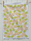 A hand block printed tea towel in a funky pineapple design