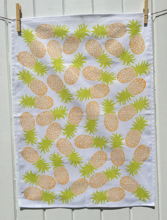A hand block printed tea towel in a funky pineapple design