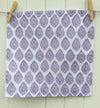 Hand block printed napkin using a Paisley Indian wooden printing block in Purple fabric paint, block printed in Oxfordshire