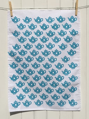 A hand block printed tea towel, printed using a Indian wooden printing block and fabric paint