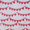 Block printed fabric in a red Bunting design