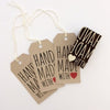 A hand carved Indian wooden printing block in a 'hand made with love' text design. Printing block can be used to hand print fabric and paper.