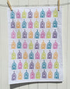 A hand block printed tea towel in a multi coloured block print design