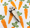 A hand carved indian wooden printing block in a Carrot design