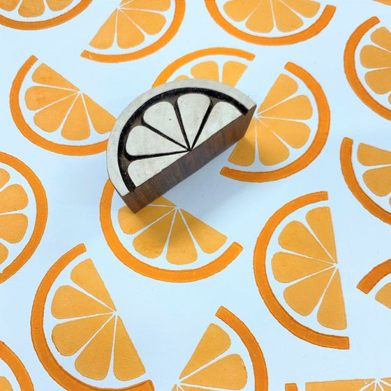 A hand carved Indian wooden printing block in a Orange slice design, can be used for hand printing your own fabric and paper