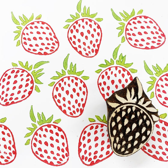 A hand carved Indian wooden printing block in a Strawberry design