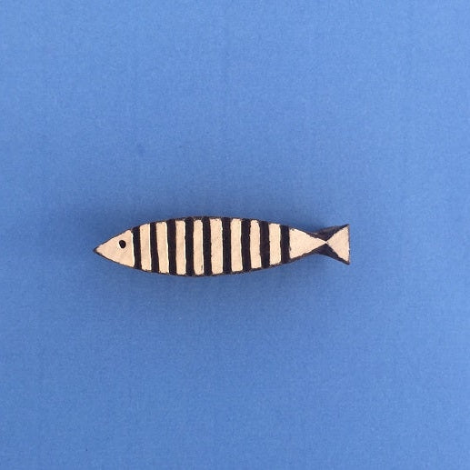 A hand carved Indian wooden printing block in a Skinny Fish design