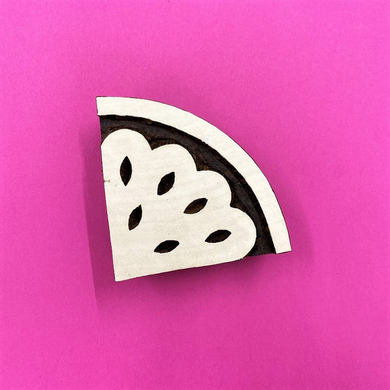 A hand carved Indian wooden printing block in a Watermelon Slice design