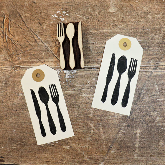 Block printed gift tags, printed using acrylic paint and a knife, fork and spoon Indian wooden printing block