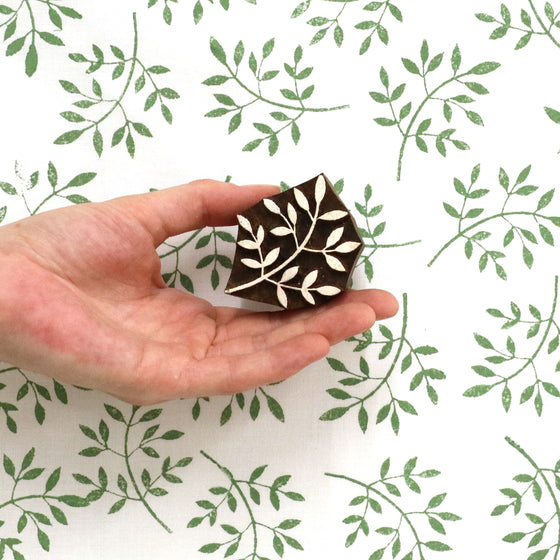 A photo of a indian wooden printing block in a Leaf Bunch design
