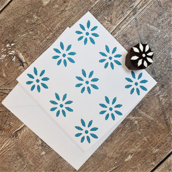 Hand block printed card, printed using turquoise acrylic paint and a mini 8 petal daisy Indian wooden printing block