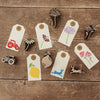 A collection of block printed gift tags using minature indian wooden printing blocks in a mixture of designs