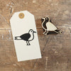 A hand block printed gift tag, printed using a Seagull Indian wooden printing block in black acrylic paint