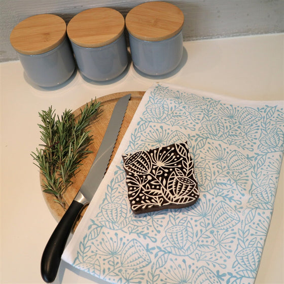 A hand block printed duck egg seed head Tea Towel