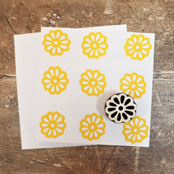 Hand block printed card in a yellow small outline flower design