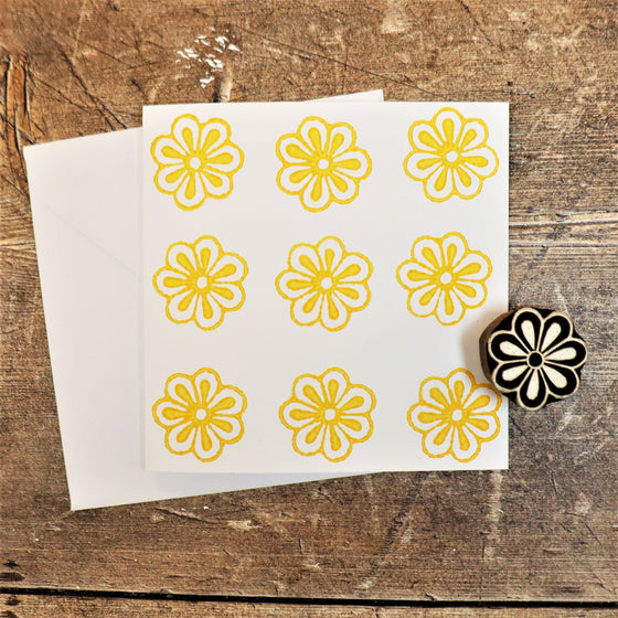 Hand block printed card, printed in yellow acrylic paint using a small flower Indian wooden printing block